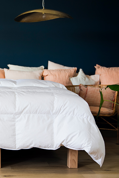 Illustration du débordement idéal d'une couette sur un lit queen size.